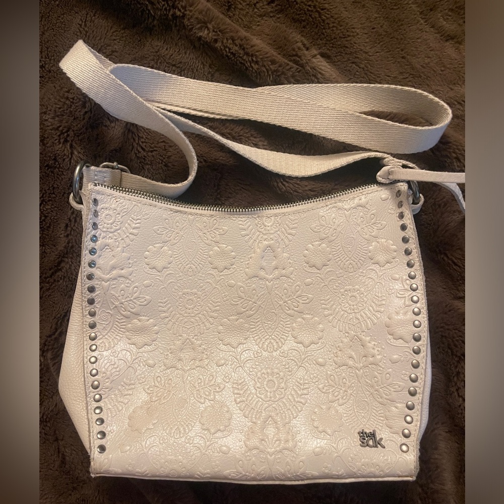 the SAK small ivory/cream purse